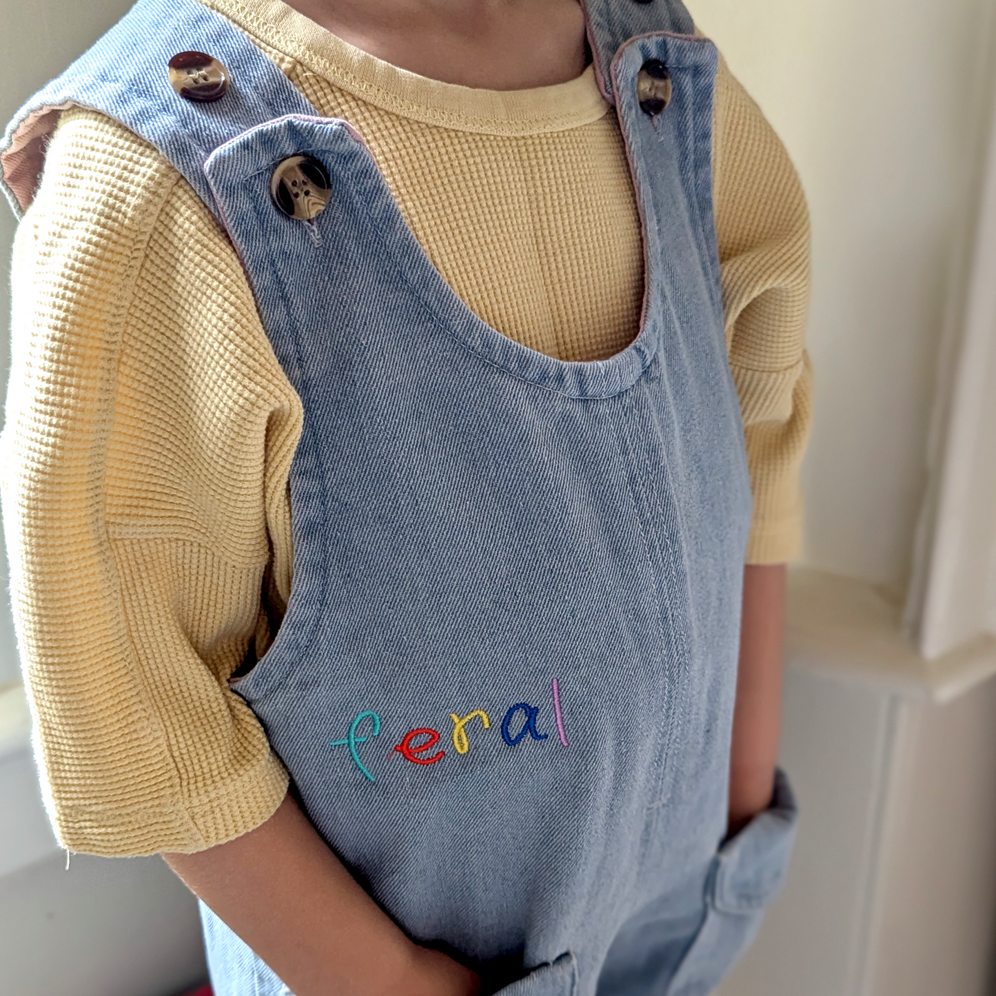 feral buttons romper