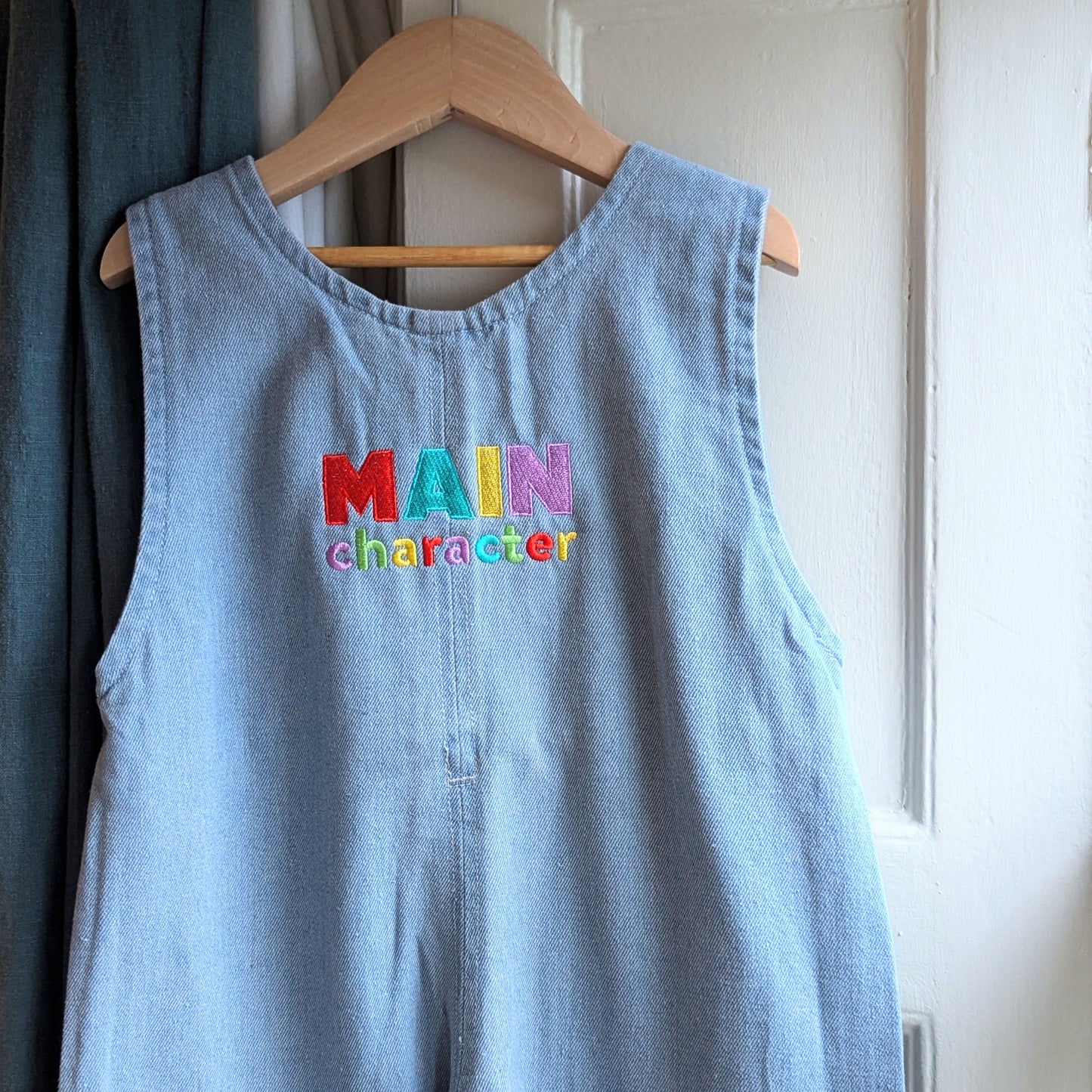 buttons jumpsuit, main character